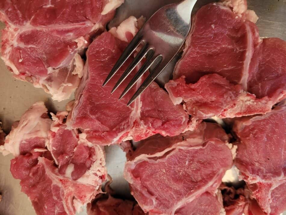 market lamb chops pictured with fork for size