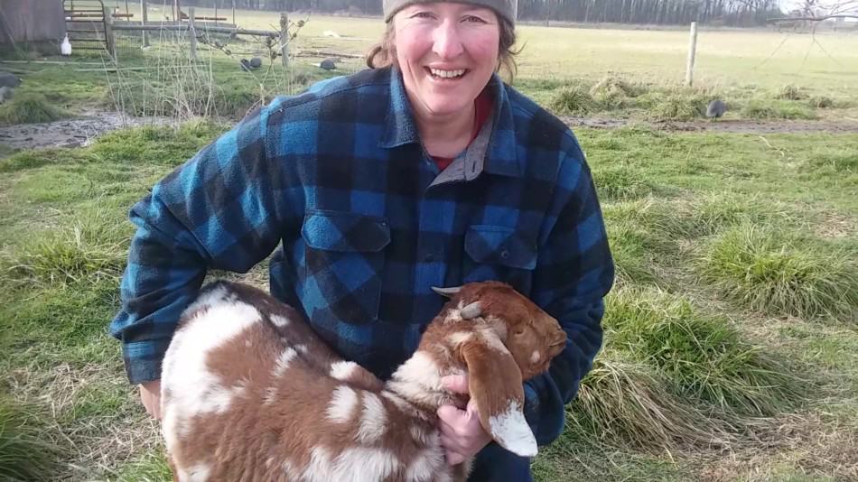 kathy mccune holding 4 month old boer doeling