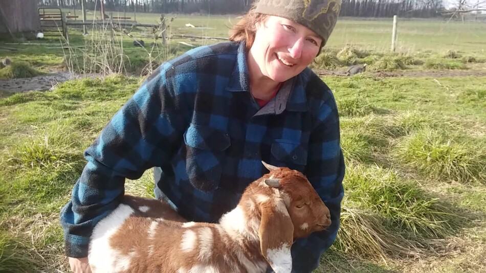 author, Kathy Mccune holding boer doeling, Agatha