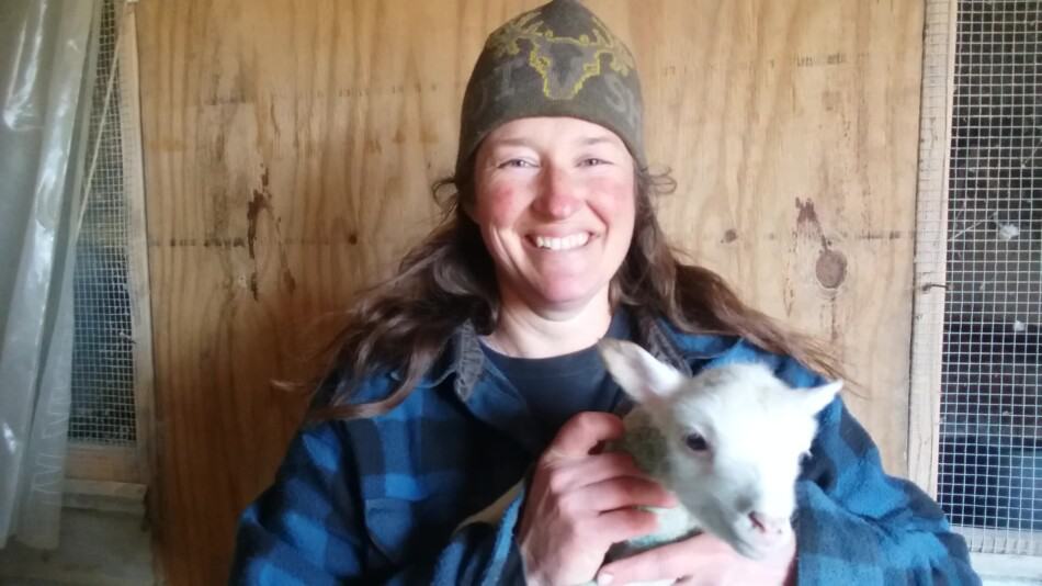 kathy mccune holding a bottle lamb