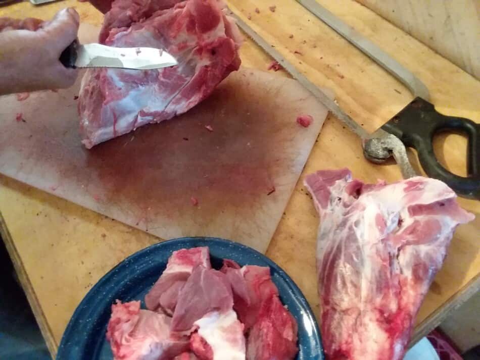 cutting up home butchered pork